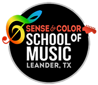 round Sense and Color School of Music logo with rainbow treble clef guitar and white lettering on black background
