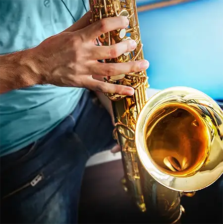 man plays saxophone